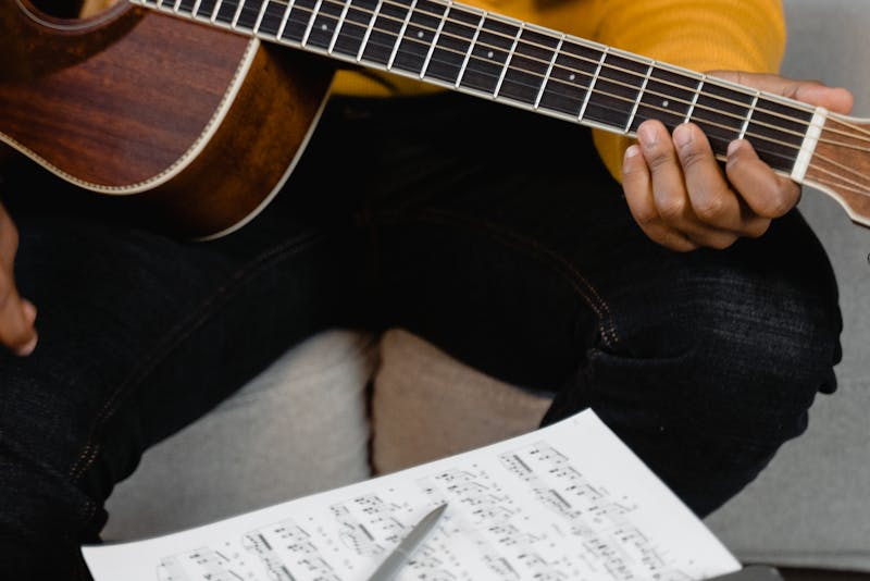 a man playing the guitar